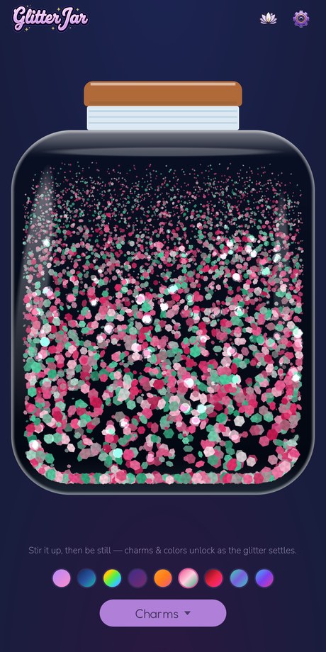 Glitter Jar in its midnight theme — magenta and jade glitter drifting through a dark jar against a starry indigo background